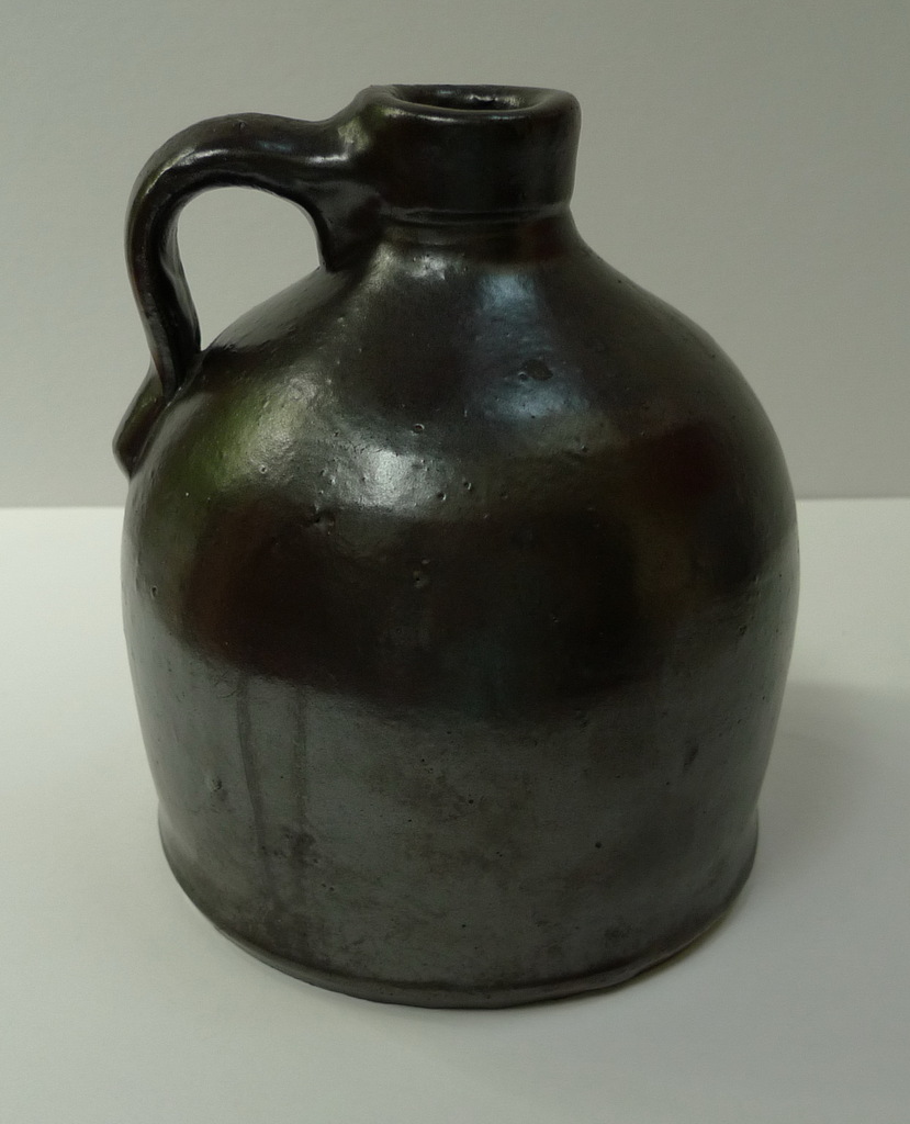 Small dark slip covered jug. ai26.