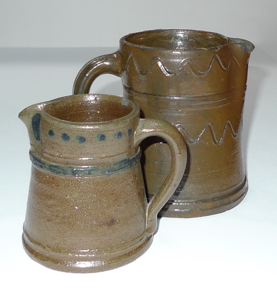 Small pitchers with similar forms but different decorations. ai32.