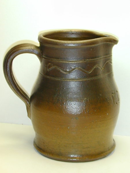 Medium sized presentation pitcher with incised line decoration and the initials F.D.H. ai8.