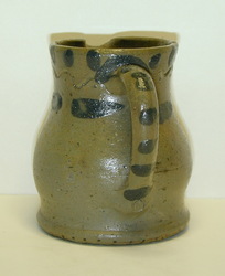 Handle view of A Present Decker pitcher. ai38.