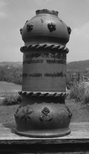 Lawn ornament made by Charles Decker, Sr. May 5, 1884. The photograph, c 1970, was taken prior to restoration of the top and bird. Burbage29.