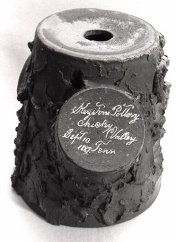 Another view of the flowerpot base which resembles a tree stump. Keystone Pottery Chucky Valley Tenn Sept 10. 1889 is incised on a flat area which simulates a large limb having been cut away. illus30.