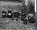 Ten pieces of pottery gathered from the property and displayed on the grass. illus1.